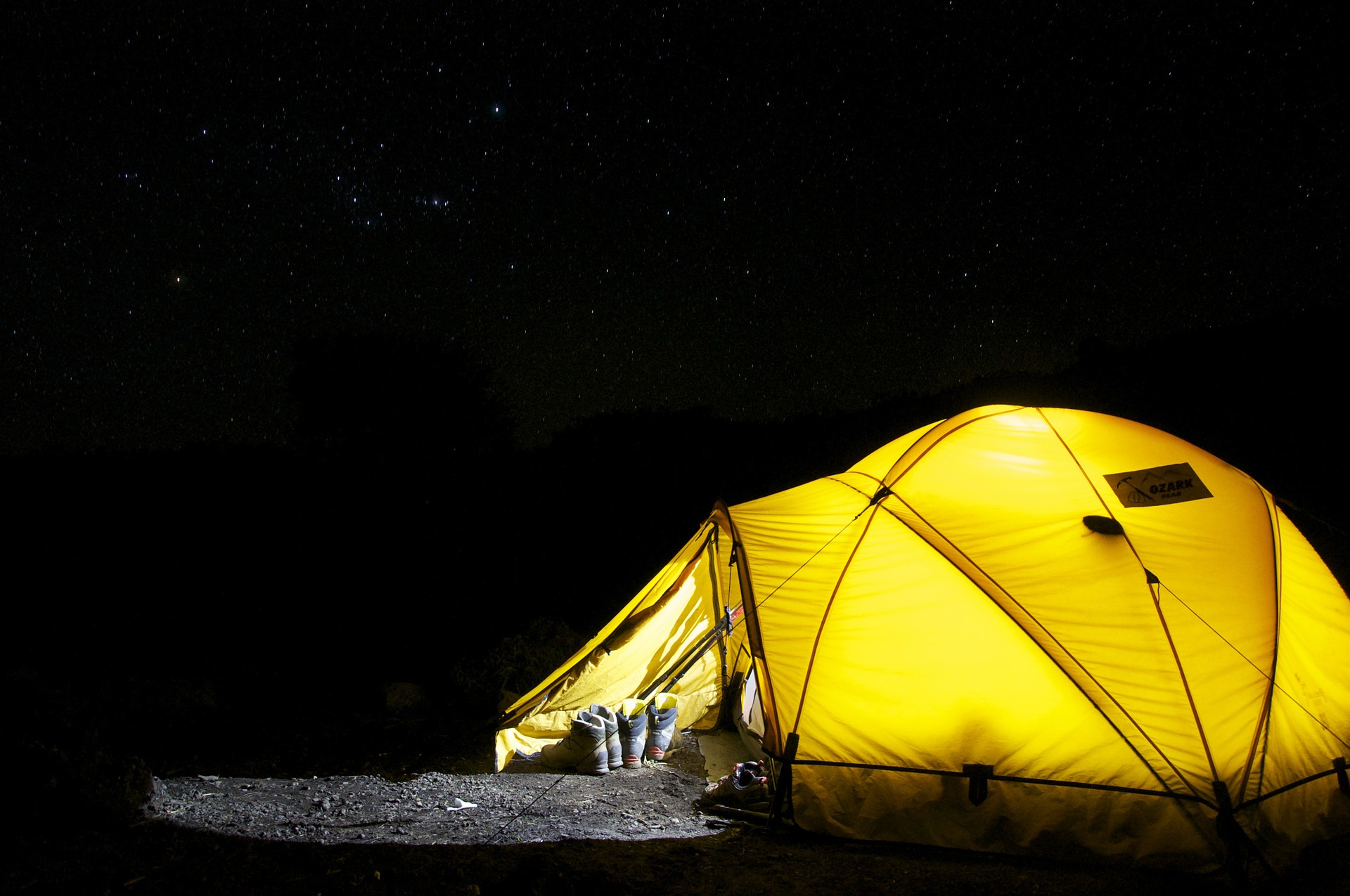 A camping tent underneath the night sky